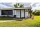 Close-up of the home's front entrance, showcasing the covered porch and front door at 433 W Grace St, Punta Gorda, FL 33950