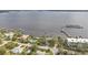 Aerial view showing waterfront home, private dock, and nearby marina at 5074 Melbourne St, Punta Gorda, FL 33980