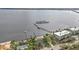 Aerial view showing waterfront home, private dock, and nearby marina at 5074 Melbourne St, Punta Gorda, FL 33980