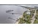 Aerial view showing waterfront home, private dock, and nearby marina at 5074 Melbourne St, Punta Gorda, FL 33980