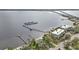 Aerial view showing waterfront home, private dock, and nearby marina at 5074 Melbourne St, Punta Gorda, FL 33980