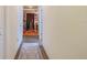 Hallway with light walls, a patterned rug, and access to another room at 7314 61St E St, Palmetto, FL 34221