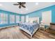 Large main bedroom with a king-size bed and access to natural light at 1064 Harbour Way Pl, Punta Gorda, FL 33983