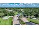 Gated community entrance with lush landscaping and a fountain at 1064 Harbour Way Pl, Punta Gorda, FL 33983