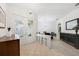 Welcoming foyer with decorative glass doors, tiled flooring, and built-in storage at 1064 Harbour Way Pl, Punta Gorda, FL 33983