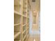 Hallway with floor-to-ceiling built-in shelving at 1064 Harbour Way Pl, Punta Gorda, FL 33983