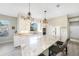 Large kitchen with a marble-topped island, white cabinetry, and stainless steel appliances at 1064 Harbour Way Pl, Punta Gorda, FL 33983
