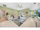 Bright living room with tile flooring, a ceiling fan, and access to the pool area at 1064 Harbour Way Pl, Punta Gorda, FL 33983