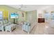 Inviting living room with comfortable seating, wood floors, and coastal decor at 1064 Harbour Way Pl, Punta Gorda, FL 33983