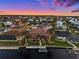 Waterfront property showcasing private boat dock and expansive backyard in a coastal community with surrounding canals at 1422 Kittiwake Dr, Punta Gorda, FL 33950