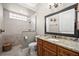 Well-appointed guest bathroom with granite countertop and walk-in shower at 1422 Kittiwake Dr, Punta Gorda, FL 33950