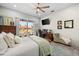 Bright bedroom with water views and comfortable sitting area at 1422 Kittiwake Dr, Punta Gorda, FL 33950