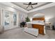 Spacious Primary bedroom with wood bed frame and access to private balcony at 1422 Kittiwake Dr, Punta Gorda, FL 33950