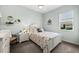 Charming guest bedroom with coastal decor and a comfortable bed at 1422 Kittiwake Dr, Punta Gorda, FL 33950