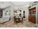 Casual breakfast nook with a round table and chairs, adjacent to kitchen at 1422 Kittiwake Dr, Punta Gorda, FL 33950