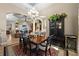 Bright dining room with a table for six and views into the living room at 1422 Kittiwake Dr, Punta Gorda, FL 33950