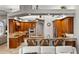 Modern kitchen with wood cabinets, granite counters, and breakfast bar seating at 1422 Kittiwake Dr, Punta Gorda, FL 33950