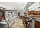 Open concept kitchen with breakfast bar, granite counters and views to pool at 1422 Kittiwake Dr, Punta Gorda, FL 33950