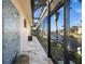 Outdoor shower with mosaic tile and canal view at 1422 Kittiwake Dr, Punta Gorda, FL 33950