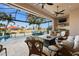 Relaxing pool and patio area with outdoor kitchen and seating at 1422 Kittiwake Dr, Punta Gorda, FL 33950