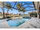 Enclosed pool and spa with water features and patio area at 1422 Kittiwake Dr, Punta Gorda, FL 33950