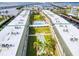 Aerial view showing building, pool, and shuffleboard at 150 Harborside Ave # 313, Punta Gorda, FL 33950