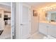 Bright bathroom with white vanity, double sinks, and a shower/tub combo at 150 Harborside Ave # 313, Punta Gorda, FL 33950