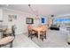 Dining area with table and chairs, adjacent to kitchen and living room at 150 Harborside Ave # 313, Punta Gorda, FL 33950