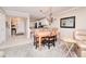 Bright dining area with light colored floors and chandelier at 150 Harborside Ave # 313, Punta Gorda, FL 33950