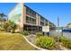 Building exterior with a mural and private parking at 150 Harborside Ave # 313, Punta Gorda, FL 33950