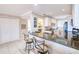 Kitchen with breakfast bar and view into living area at 150 Harborside Ave # 313, Punta Gorda, FL 33950