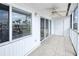 Spacious screened balcony with tile floors and ceiling fan at 150 Harborside Ave # 313, Punta Gorda, FL 33950
