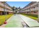 Community shuffleboard court with green surface and markings at 150 Harborside Ave # 313, Punta Gorda, FL 33950