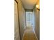 Hallway with tile flooring leading to bedrooms at 1626 Sharpe St, Port Charlotte, FL 33952