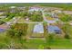 Aerial view of a home's backyard enclosed by a fence, showing nearby buildings at 1833 Marconi Ave, North Port, FL 34286