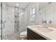Modern bathroom with a walk-in shower and floating vanity at 18854 Ackerman Ave, Port Charlotte, FL 33948