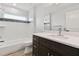 Bright bathroom featuring a single vanity and bathtub at 18854 Ackerman Ave, Port Charlotte, FL 33948