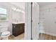 Bathroom with a double vanity, a toilet, and linen closet at 18854 Ackerman Ave, Port Charlotte, FL 33948