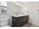 Bathroom with a double vanity and a large mirror at 18854 Ackerman Ave, Port Charlotte, FL 33948