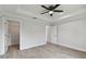 Spacious bedroom with wood-look floors and walk-in closet at 18854 Ackerman Ave, Port Charlotte, FL 33948