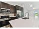 Modern kitchen with stainless steel appliances and an open floor plan at 18854 Ackerman Ave, Port Charlotte, FL 33948