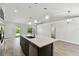 Open concept kitchen with an island and stainless steel appliances at 18854 Ackerman Ave, Port Charlotte, FL 33948
