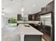 Open kitchen with large island, stainless steel appliances, and ample counter space at 18854 Ackerman Ave, Port Charlotte, FL 33948