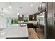 Modern kitchen with an island, stainless steel appliances, and white quartz countertops at 18854 Ackerman Ave, Port Charlotte, FL 33948