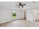 Main bedroom with ceiling fan, large closet, and bathroom access at 18854 Ackerman Ave, Port Charlotte, FL 33948