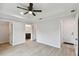 Main bedroom with wood-look floors and ceiling fan at 18854 Ackerman Ave, Port Charlotte, FL 33948