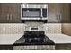 Stainless steel microwave above the stovetop at 18854 Ackerman Ave, Port Charlotte, FL 33948