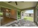 Screened patio with access to living room and backyard at 18854 Ackerman Ave, Port Charlotte, FL 33948