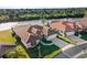High-angle view of home and neighboring properties nestled along a canal at 1946 Cove Pointe Dr, Venice, FL 34293