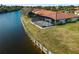 Waterfront home with seawall, screened lanai, and pool at 1946 Cove Pointe Dr, Venice, FL 34293